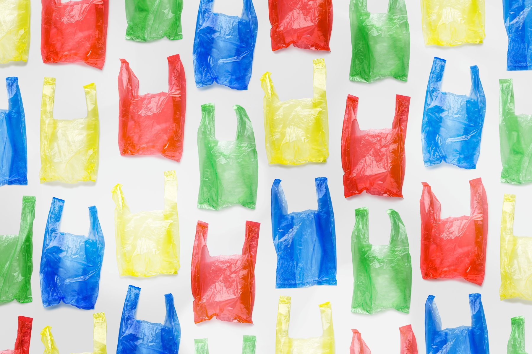 Multicoloured plastic bags - plastic and paper bag reporting.